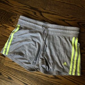 Grey Adidas shorts with neon stripe